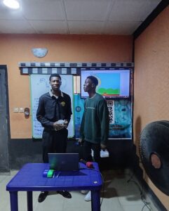 Mr Abraham receiving his gift from Judge Joshua after his presentation.