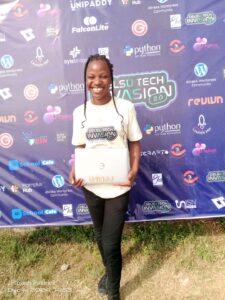 An attendee showing her received laptop from Hamplus Hub